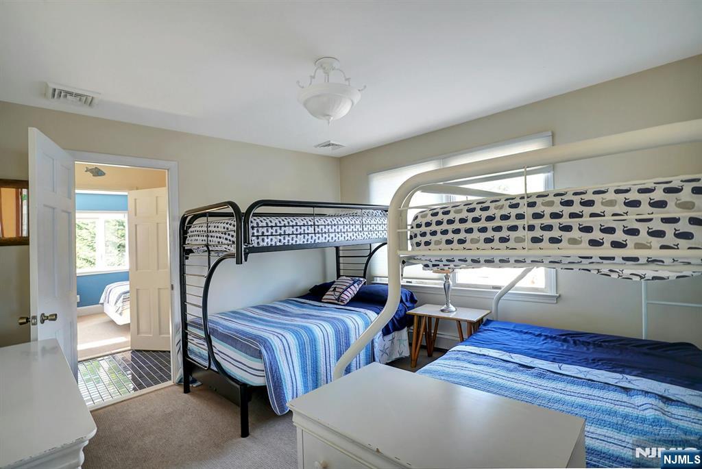 599 Point Avenue Brick, NJ 08724 - Photo 18 of 48 a bedroom with bed and wooden floor