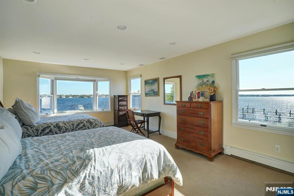 599 Point Avenue Brick, NJ 08724 - Photo 19 of 48 a bedroom with a bed and large windows