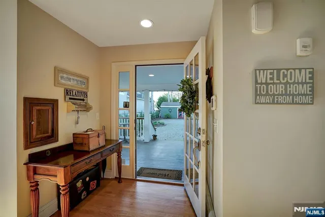 a living room with furniture and large windows