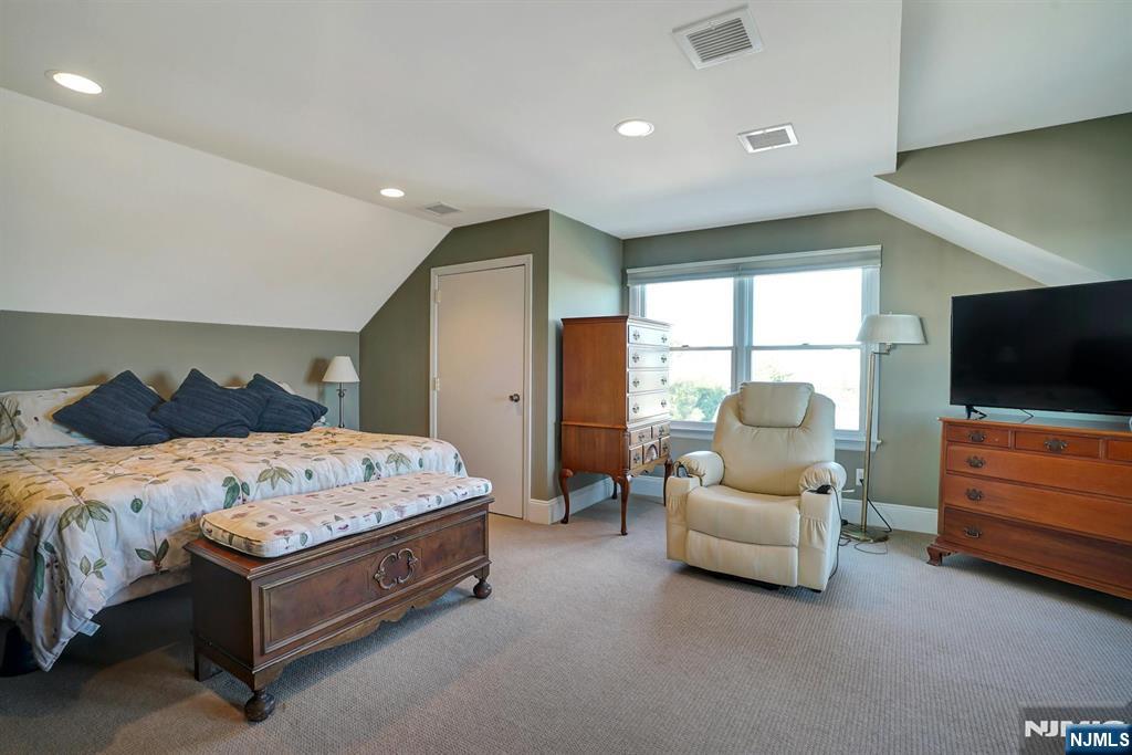 599 Point Avenue Brick, NJ 08724 - Photo 26 of 48 a spacious bedroom with a bed and a flat screen tv