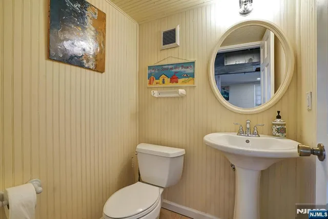 a kitchen with a stove a sink and a microwave