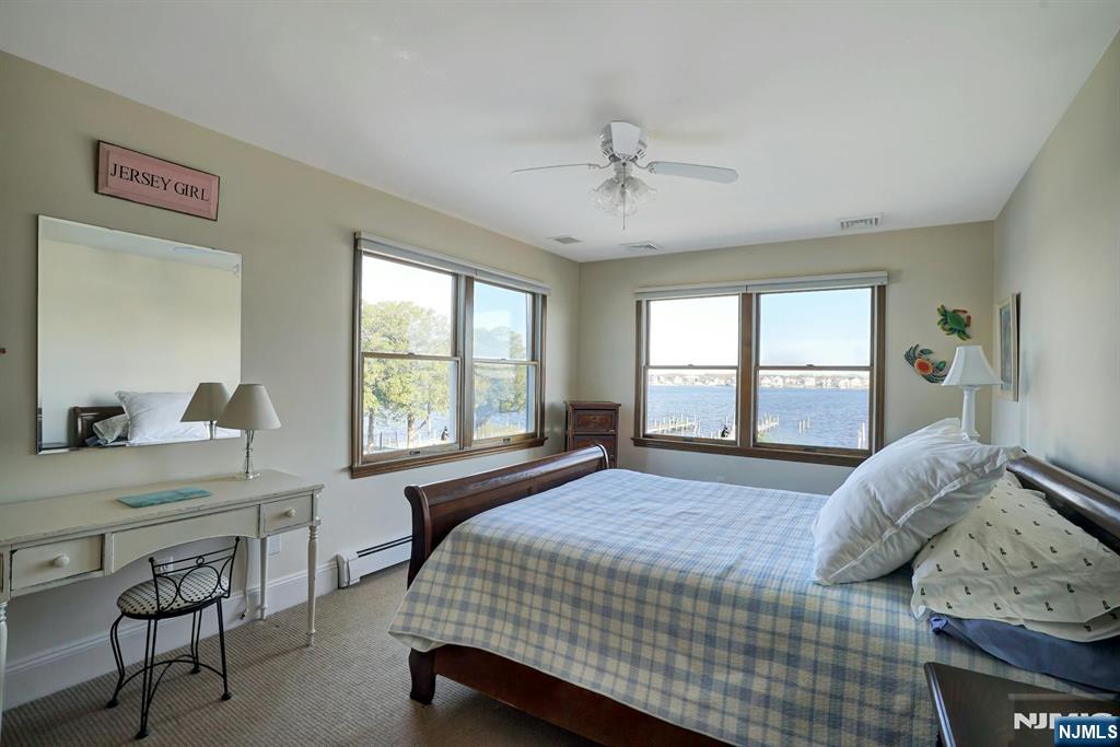 599 Point Avenue Brick, NJ 08724 - Photo 29 of 48 a bedroom with a bed a table and chair