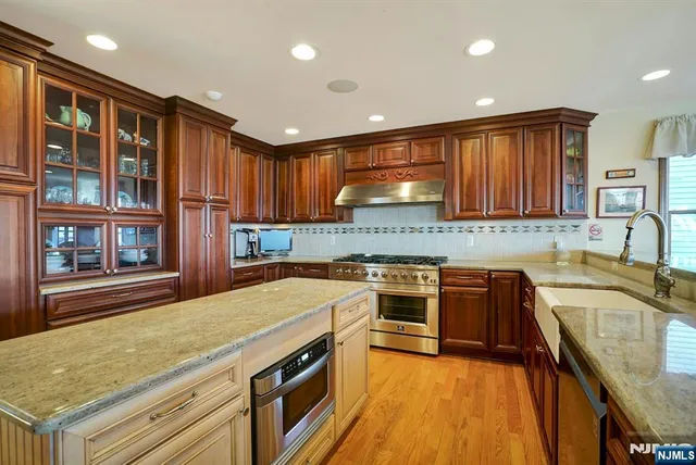 a large kitchen with a table and chairs in it