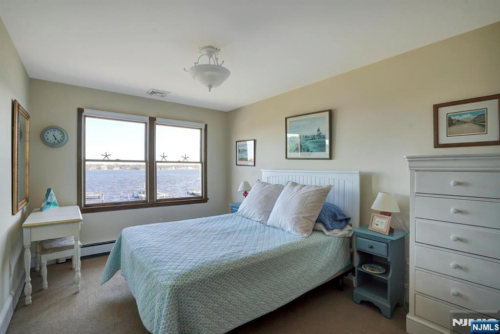 599 Point Avenue Brick, NJ 08724 - Photo 35 of 48 a bedroom with a large bed and a window