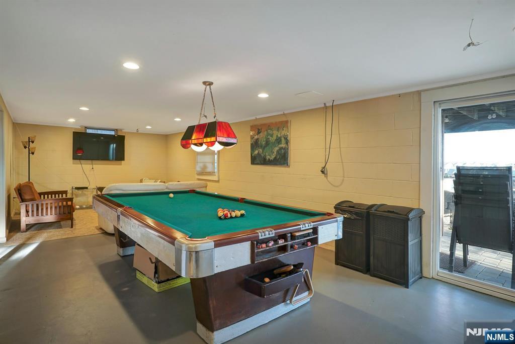 599 Point Avenue Brick, NJ 08724 - Photo 42 of 48 a room with pool table table and flat screen tv