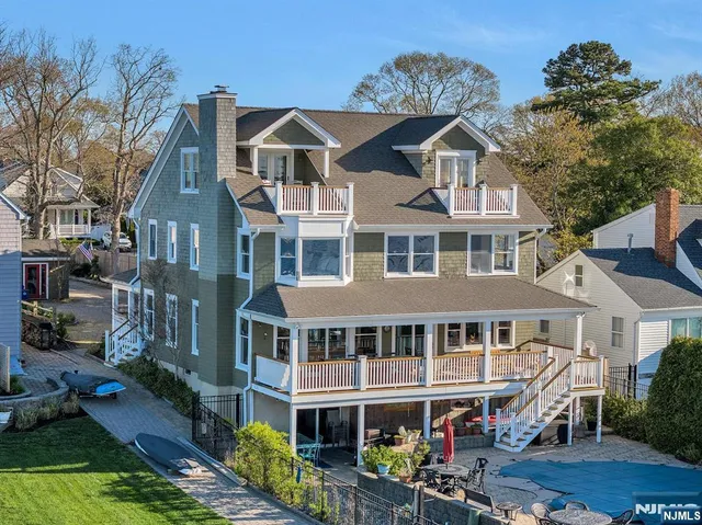 a front view of a residential apartment building with a yard