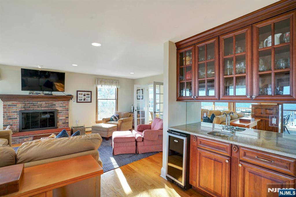 599 Point Avenue Brick, NJ 08724 - Photo 8 of 48 a living room with furniture a flat screen tv and a fireplace