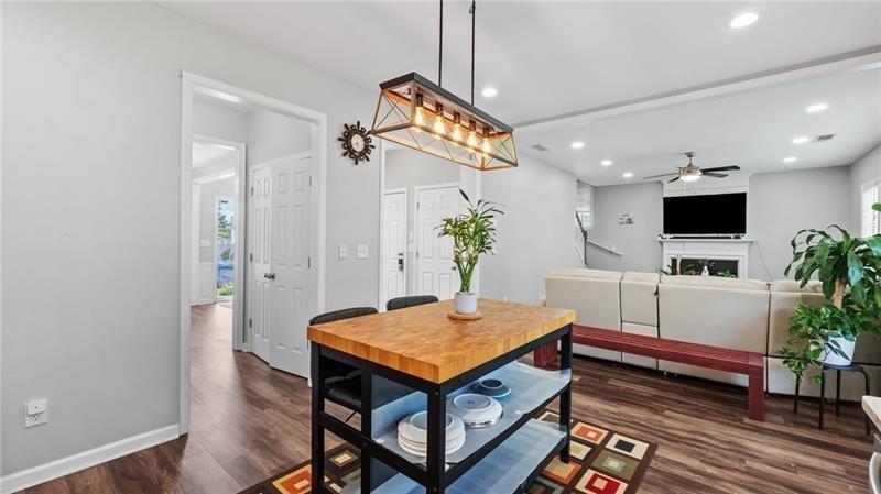 3525 Elder Field Lane Cumming, GA 30040 - Photo 12 of 45 a living room with furniture and a flat screen tv