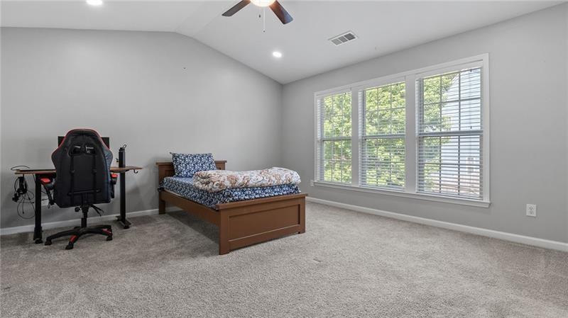 3525 Elder Field Lane Cumming, GA 30040 - Photo 14 of 45 a bedroom with a bed and a window