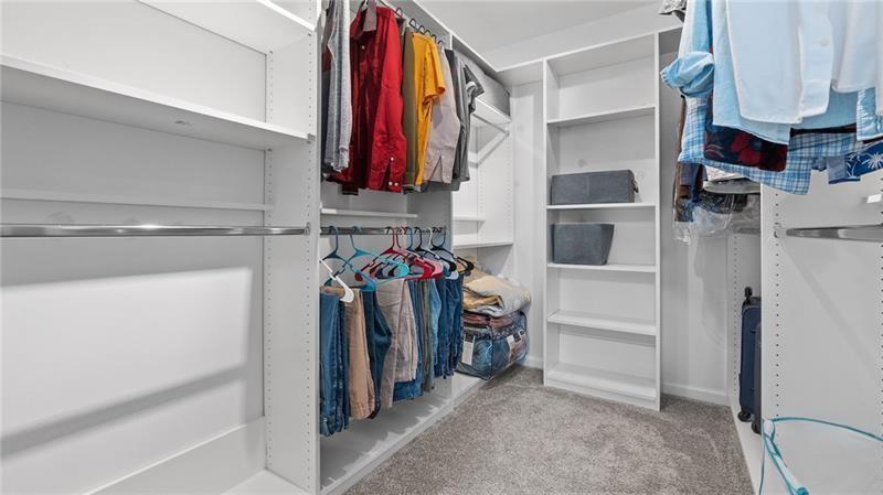 3525 Elder Field Lane Cumming, GA 30040 - Photo 16 of 45 a view of walk in closet with clothes and shoes