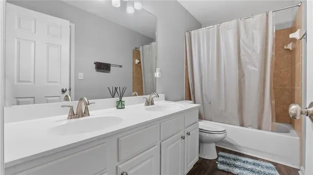 a bathroom with a sink a mirror and a bathtub