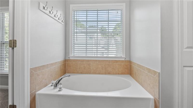 3525 Elder Field Lane Cumming, GA 30040 - Photo 20 of 45 a bathroom with a bathtub