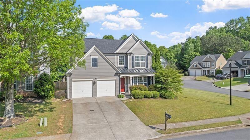 3525 Elder Field Lane Cumming, GA 30040 - Photo 2 of 45 a front view of a house with garden