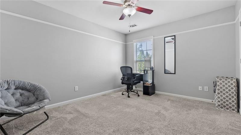 3525 Elder Field Lane Cumming, GA 30040 - Photo 23 of 45 a bedroom with furniture and a window