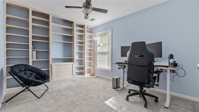 3525 Elder Field Lane Cumming, GA 30040 - Photo 27 of 45 a view of a workspace with furniture and a window