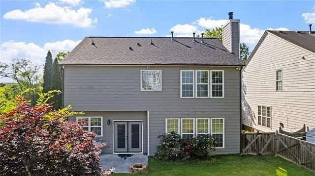 a view of a house with a yard and plants