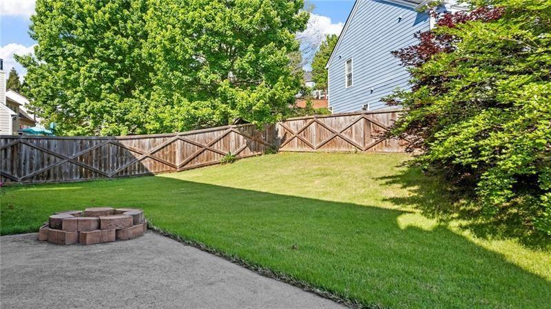 3525 Elder Field Lane Cumming, GA 30040 - Photo 32 of 45 a view of a backyard with a garden and entertaining space