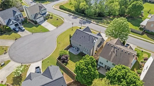 an aerial view of a house having yard