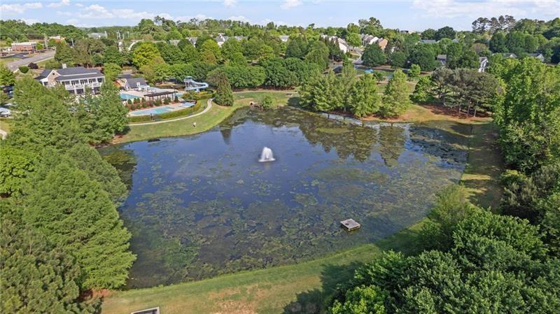 3525 Elder Field Lane Cumming, GA 30040 - Photo 41 of 45 a view of a lake with a yard