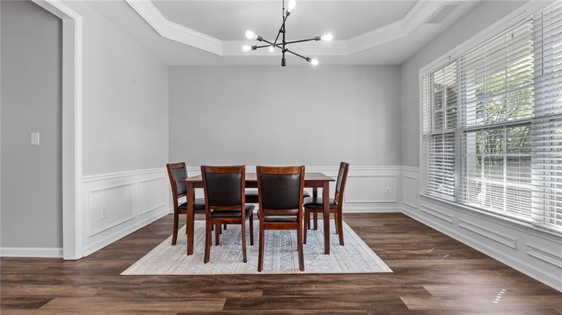 3525 Elder Field Lane Cumming, GA 30040 - Photo 5 of 45 a view of a dining room with furniture window and wooden floor