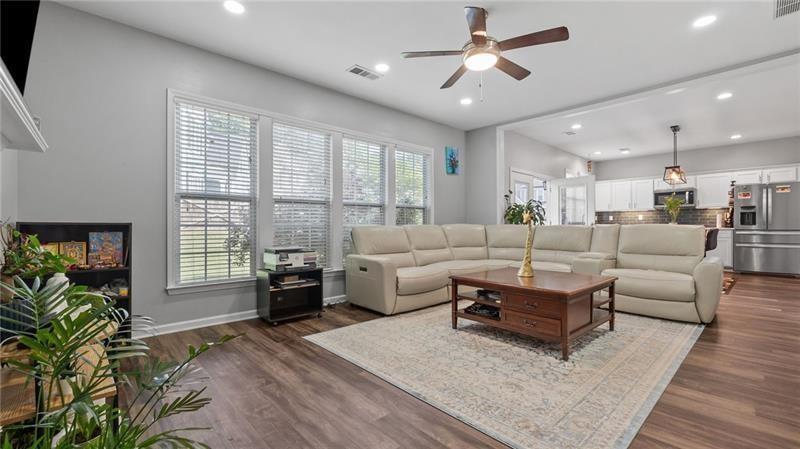 3525 Elder Field Lane Cumming, GA 30040 - Photo 9 of 45 a living room with furniture and a large window