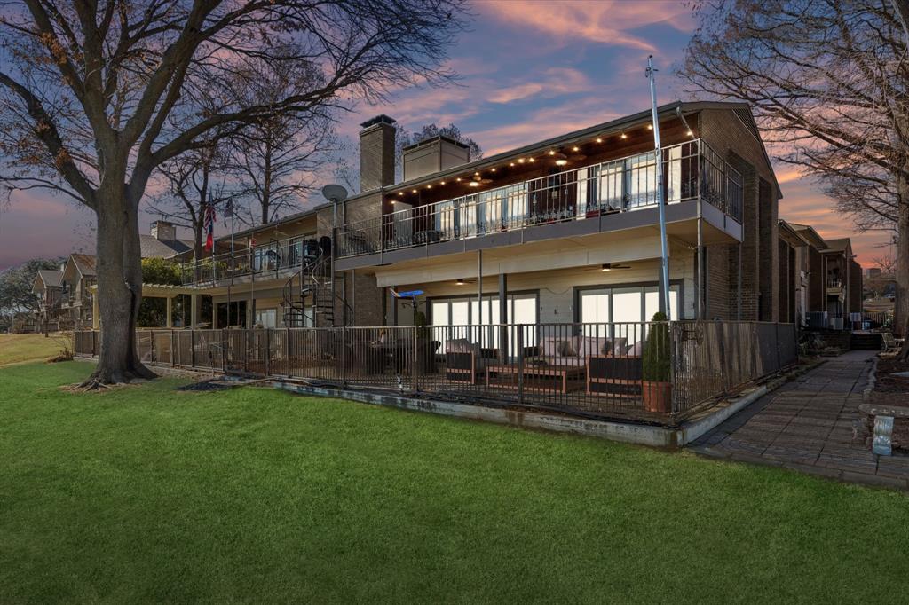 4548 Chaha Road, Unit 203 Garland, TX 75043 - Photo 1 of 18 a view of a house with a yard and deck