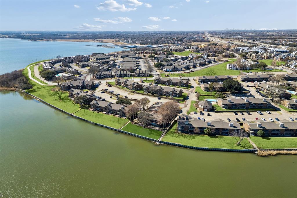 4548 Chaha Road, Unit 203 Garland, TX 75043 - Photo 16 of 18 an aerial view of a house with a lake view