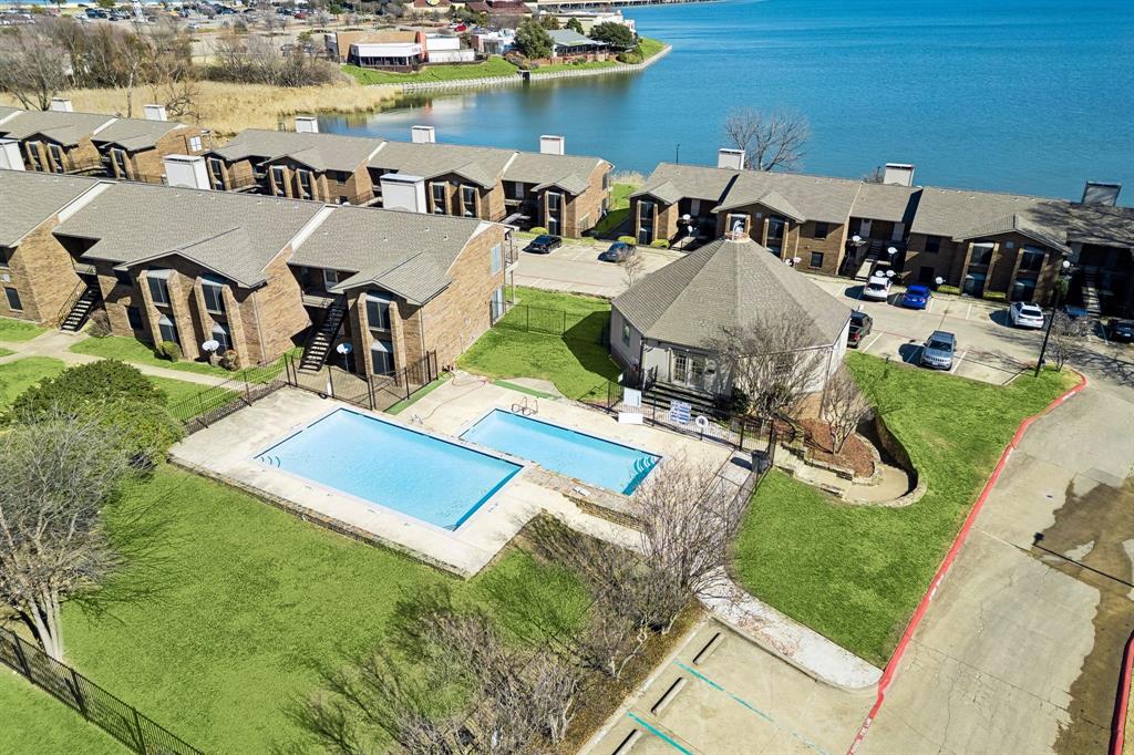 4548 Chaha Road, Unit 203 Garland, TX 75043 - Photo 7 of 18 an aerial view of a house with swimming pool and ocean view