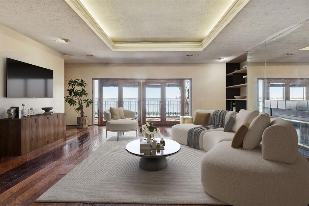 4548 Chaha Road, Unit 203 Garland, TX 75043 - Photo 10 of 18 a living room with furniture and a flat screen tv