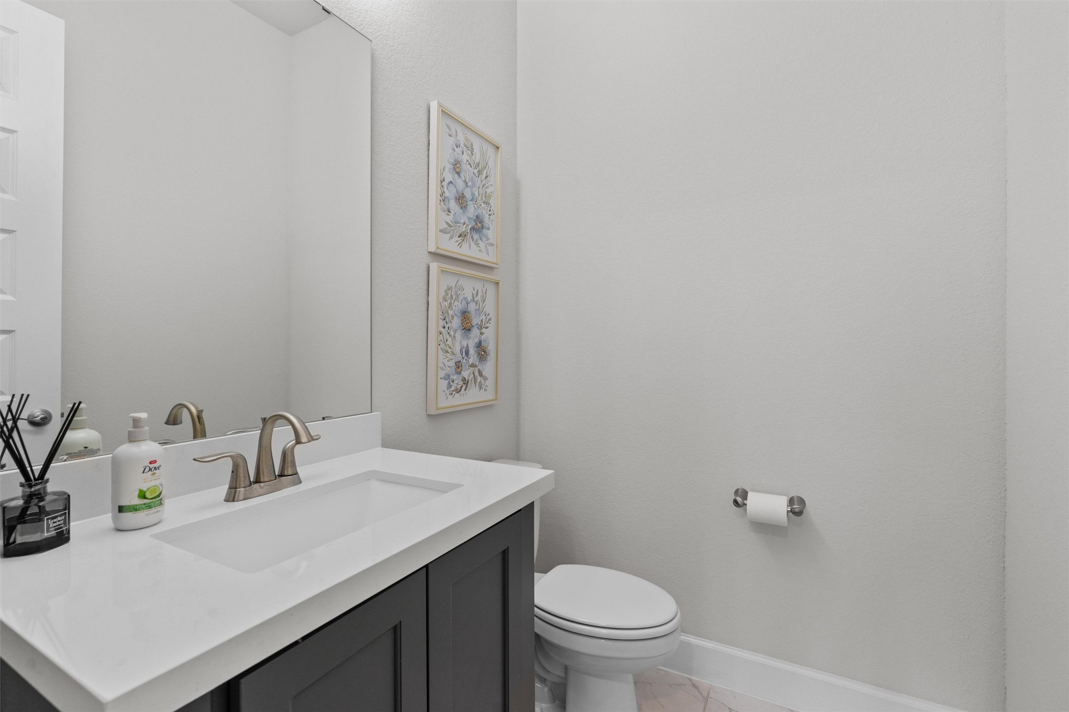 101 Pienza Drive Georgetown, TX 78628 - Photo 30 of 40 a bathroom with a sink a toilet and a mirror