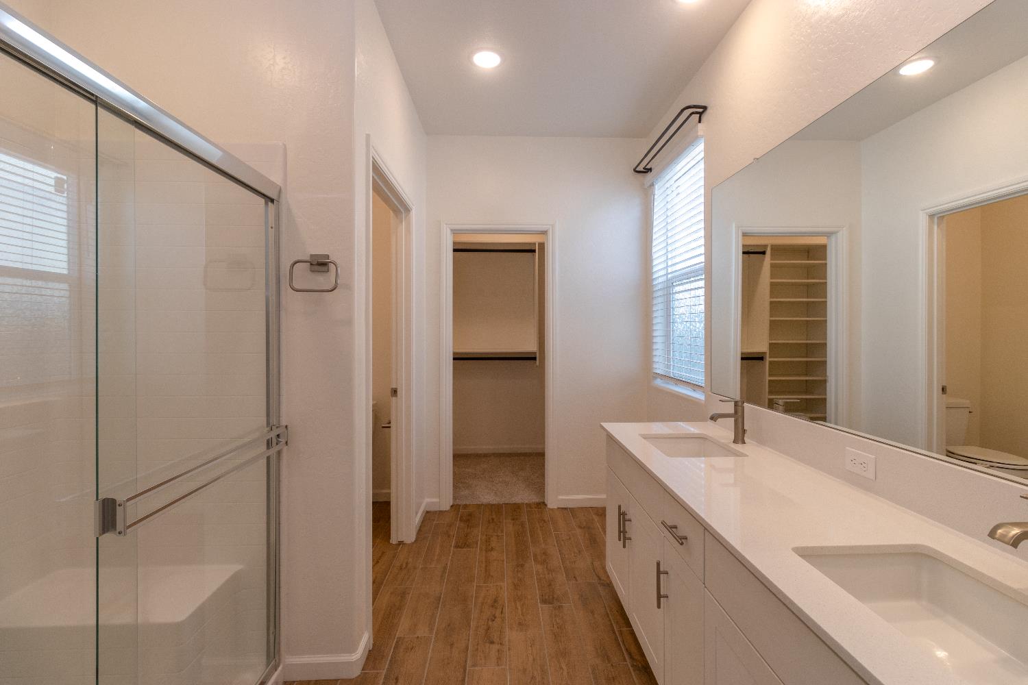 1158 Encore Way West Madera, CA 93636 - Photo 31 of 45 a spacious bathroom with a tub sink and mirror