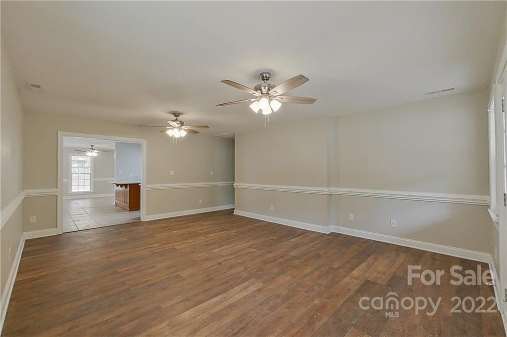 3804 Dusty Hollow Road Monroe, NC 28110 - Photo 16 of 42 wooden floor in an empty room with a window