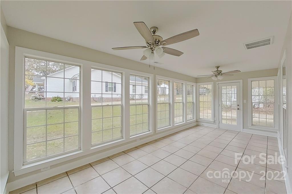 3804 Dusty Hollow Road Monroe, NC 28110 - Photo 18 of 42 a view of an empty room with a window