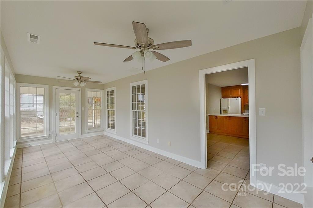 3804 Dusty Hollow Road Monroe, NC 28110 - Photo 19 of 42 a view of an empty room with window and cabinet