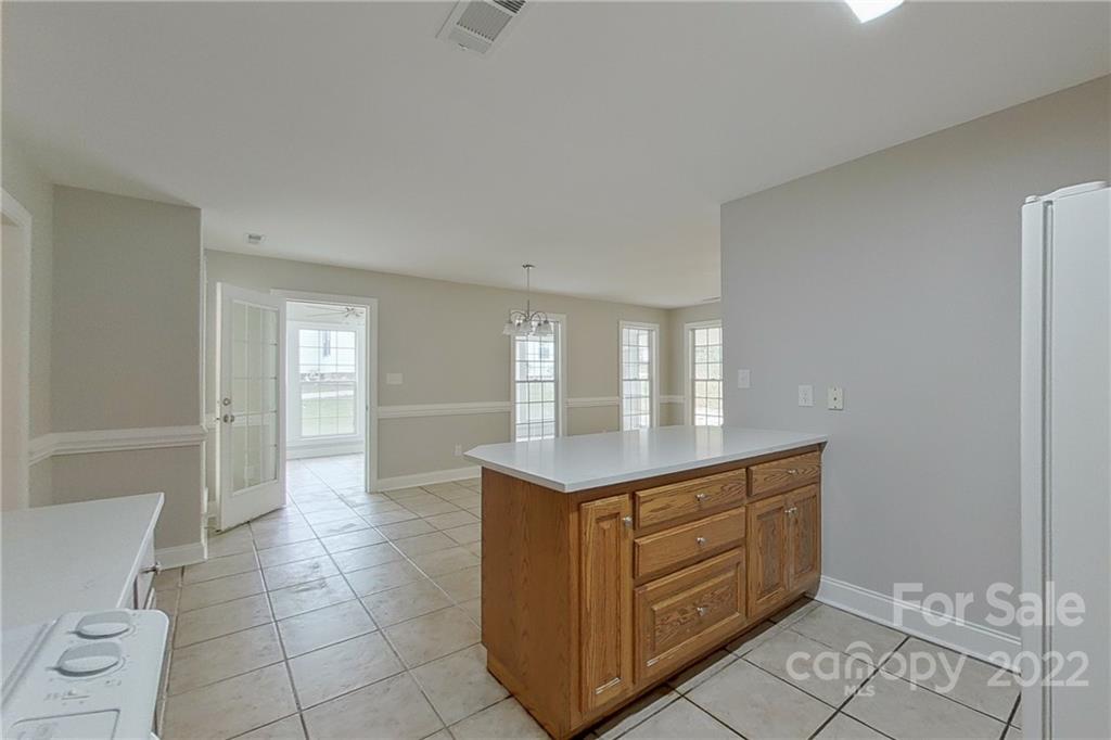 3804 Dusty Hollow Road Monroe, NC 28110 - Photo 20 of 42 a kitchen with a cabinets and window