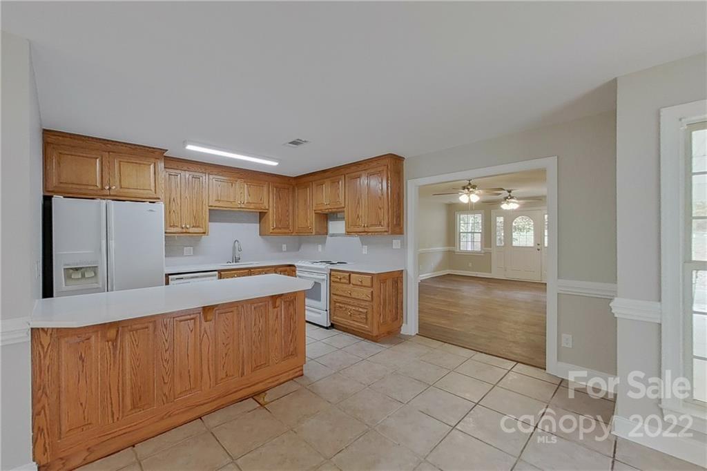 3804 Dusty Hollow Road Monroe, NC 28110 - Photo 22 of 42 a large kitchen with cabinets and stainless steel appliances