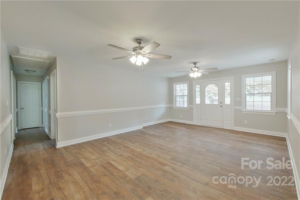 3804 Dusty Hollow Road Monroe, NC 28110 - Photo 30 of 42 wooden floor in an empty room with a window