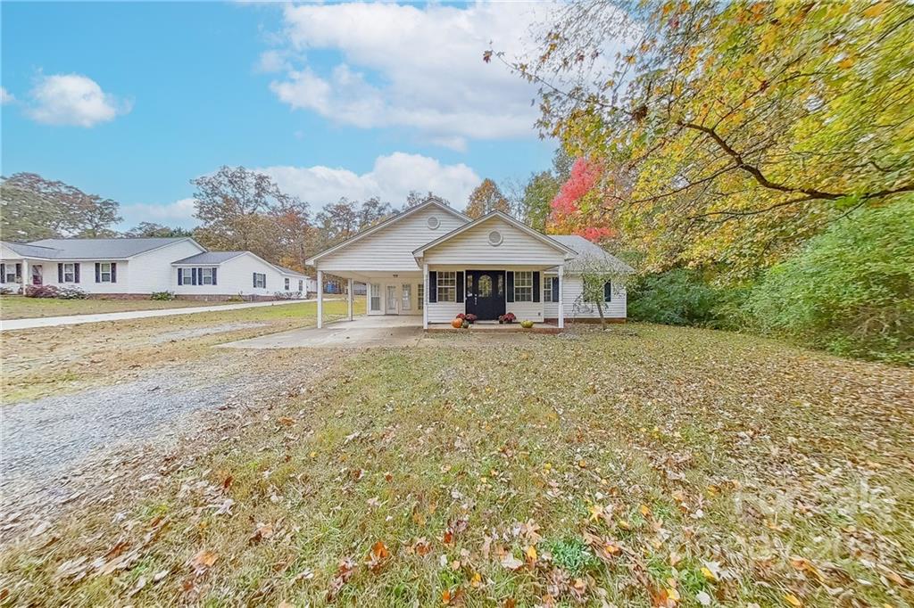 3804 Dusty Hollow Road Monroe, NC 28110 - Photo 3 of 42 a front view of a house with a garden