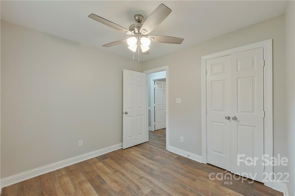 3804 Dusty Hollow Road Monroe, NC 28110 - Photo 32 of 42 a view of an empty room with wooden floor