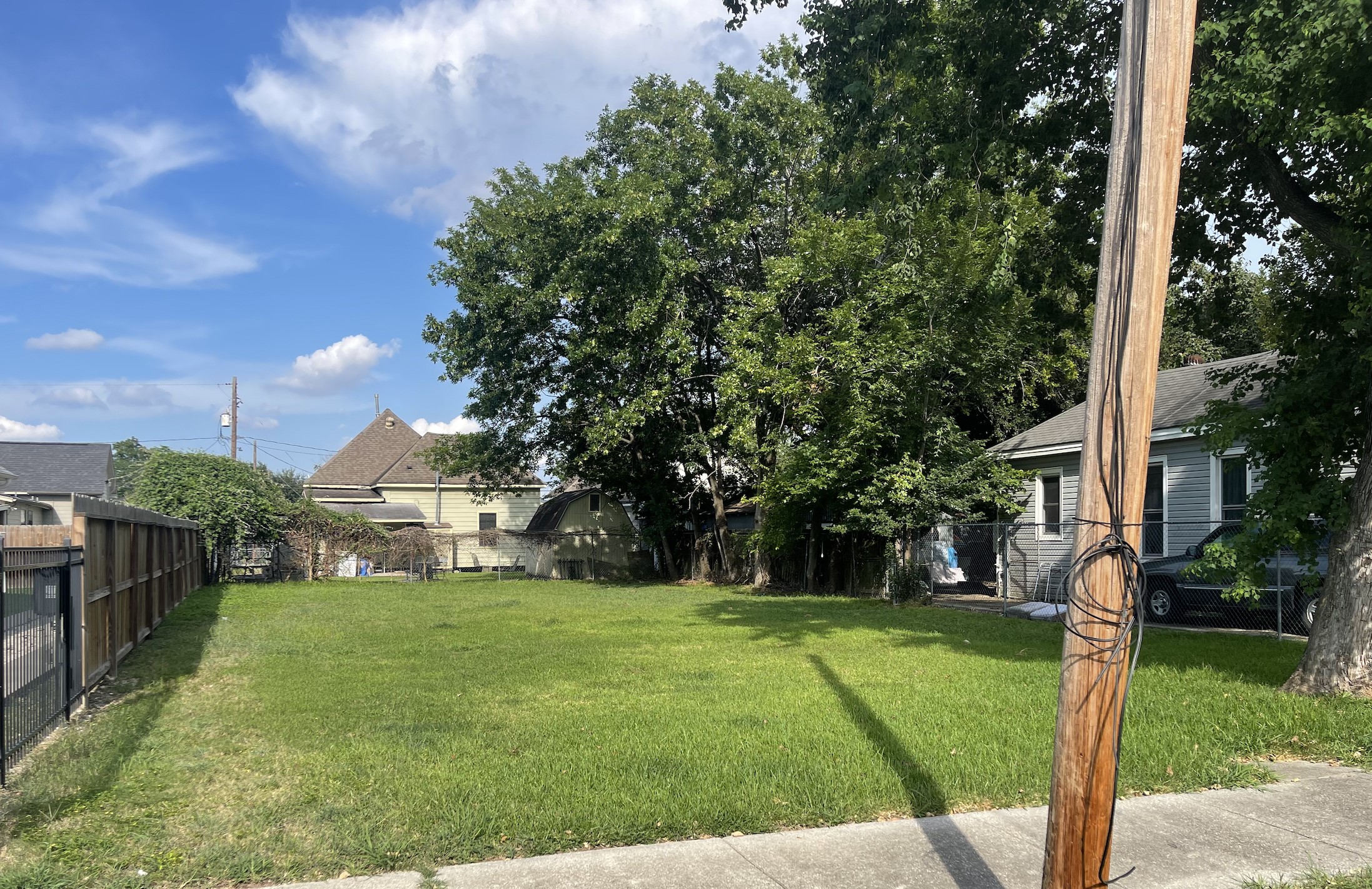 2114 Chestnut Street Houston, TX 77009 - Photo 3 of 8 a view of a house with a big yard and a large tree