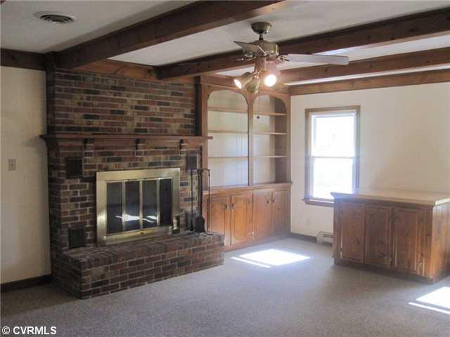251 Mariners Point Road Hudgins, VA 23076 - Photo 4 of 12 Den/Family/Great Room - Great family room with wood burning fireplace, ceiling beams and built in bookcase