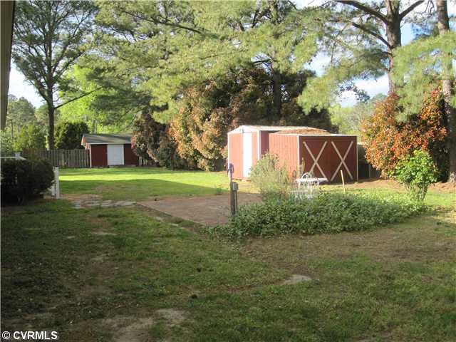 251 Mariners Point Road Hudgins, VA 23076 - Photo 10 of 12 Exterior Back - Fenced in for privacy this back yard is a retreat to relax and play. Herb gardens and small patio.