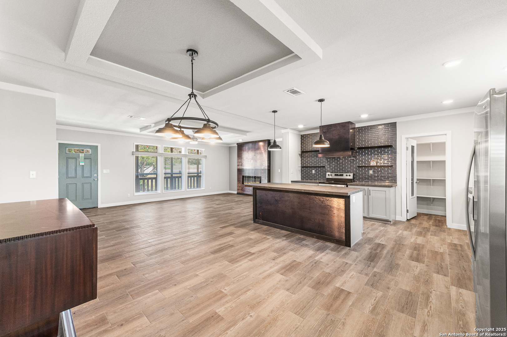 9130 Rebecca Creek Road Spring Branch, TX 78070 - Photo 13 of 77 a view of kitchen with sink microwave and refrigerator