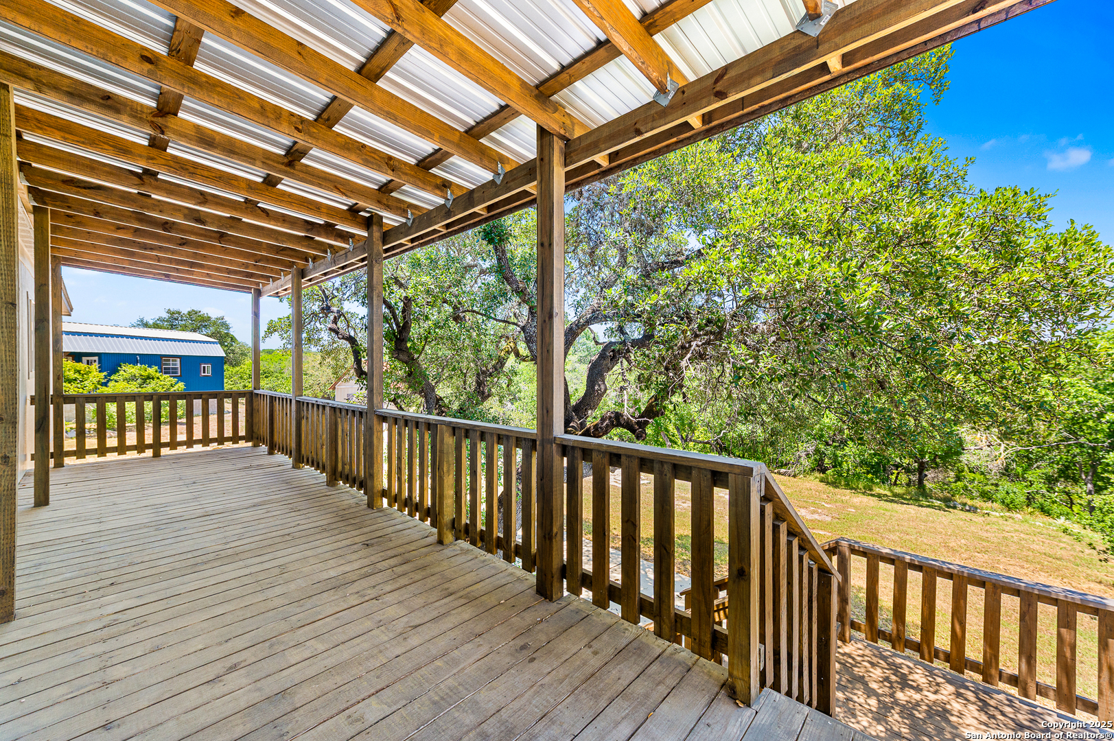9130 Rebecca Creek Road Spring Branch, TX 78070 - Photo 39 of 77 a view of a balcony with wooden floor