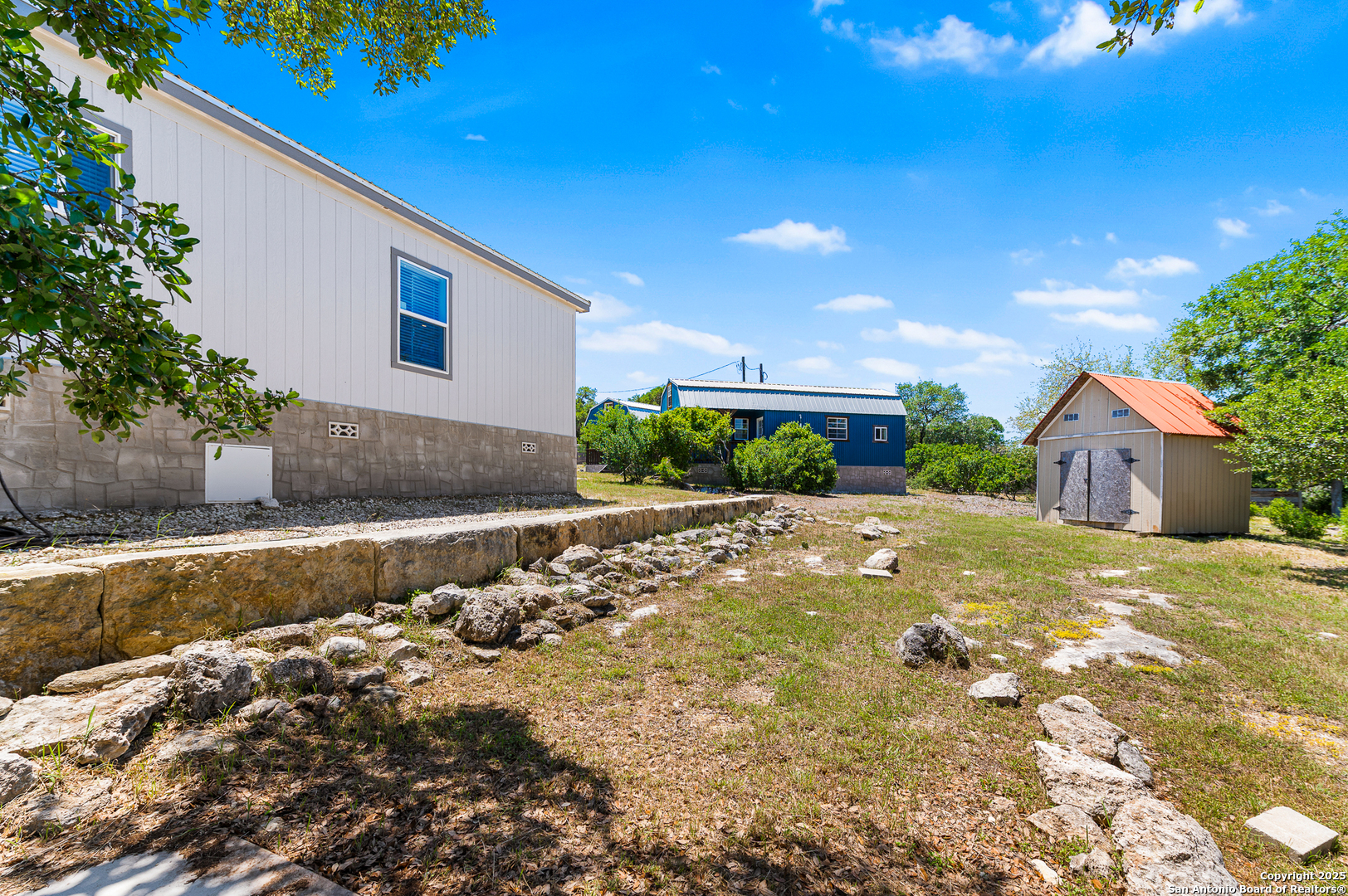 9130 Rebecca Creek Road Spring Branch, TX 78070 - Photo 40 of 77 a view of a house with a yard
