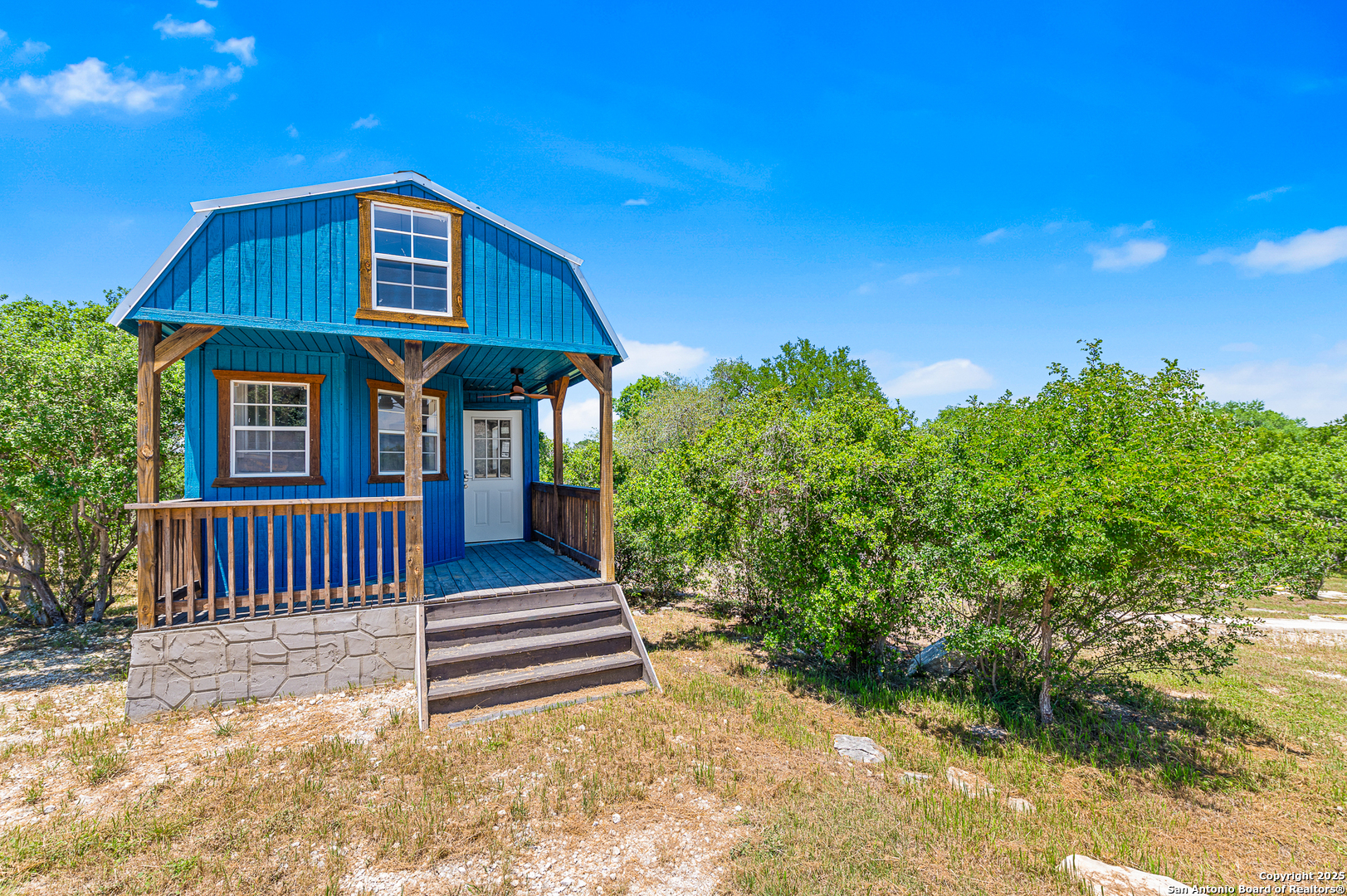 9130 Rebecca Creek Road Spring Branch, TX 78070 - Photo 42 of 77 a front view of a house with a yard