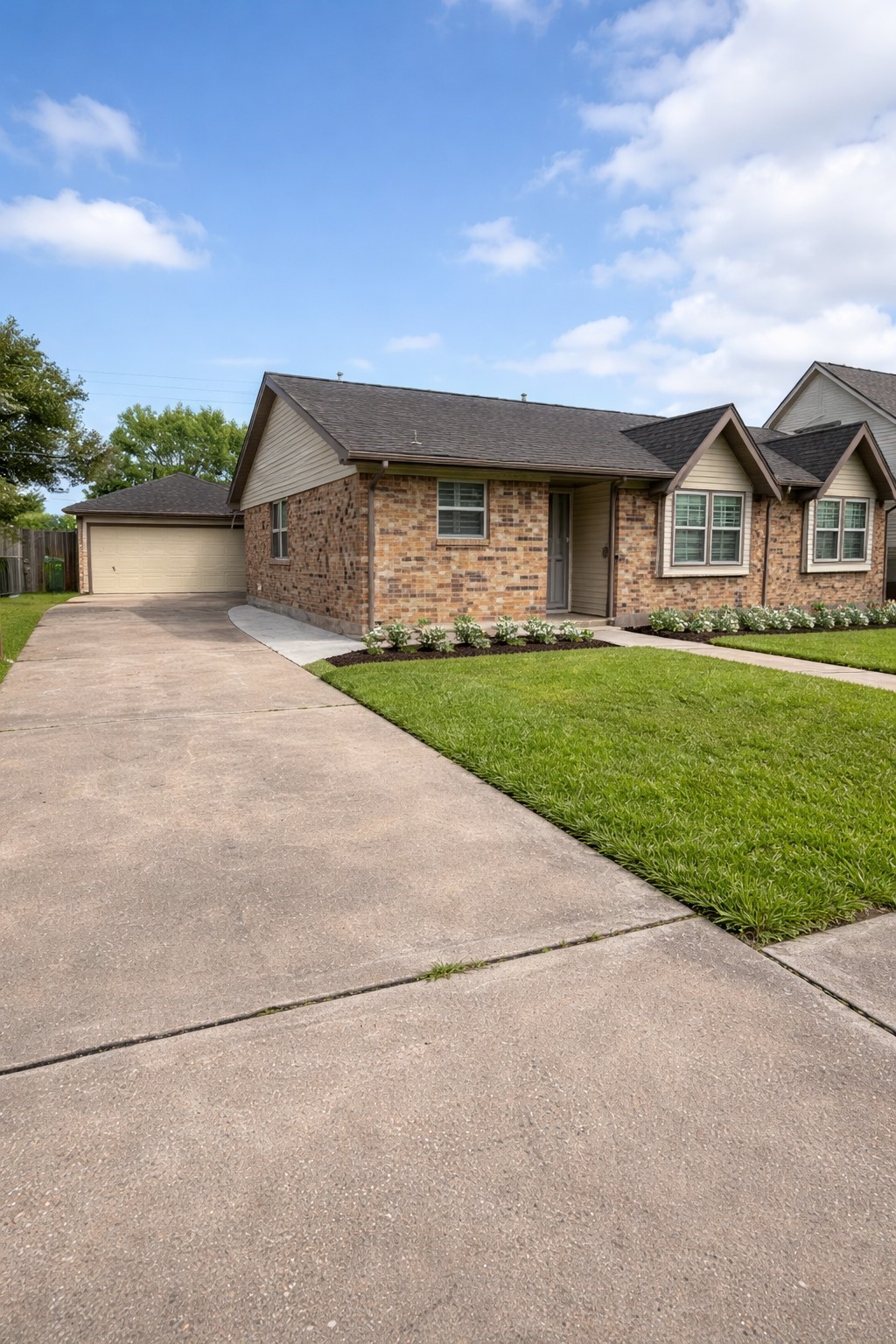 4415 Seminole Street Pasadena, TX 77504 - Photo 2 of 13 a front view of a house with a yard and garage