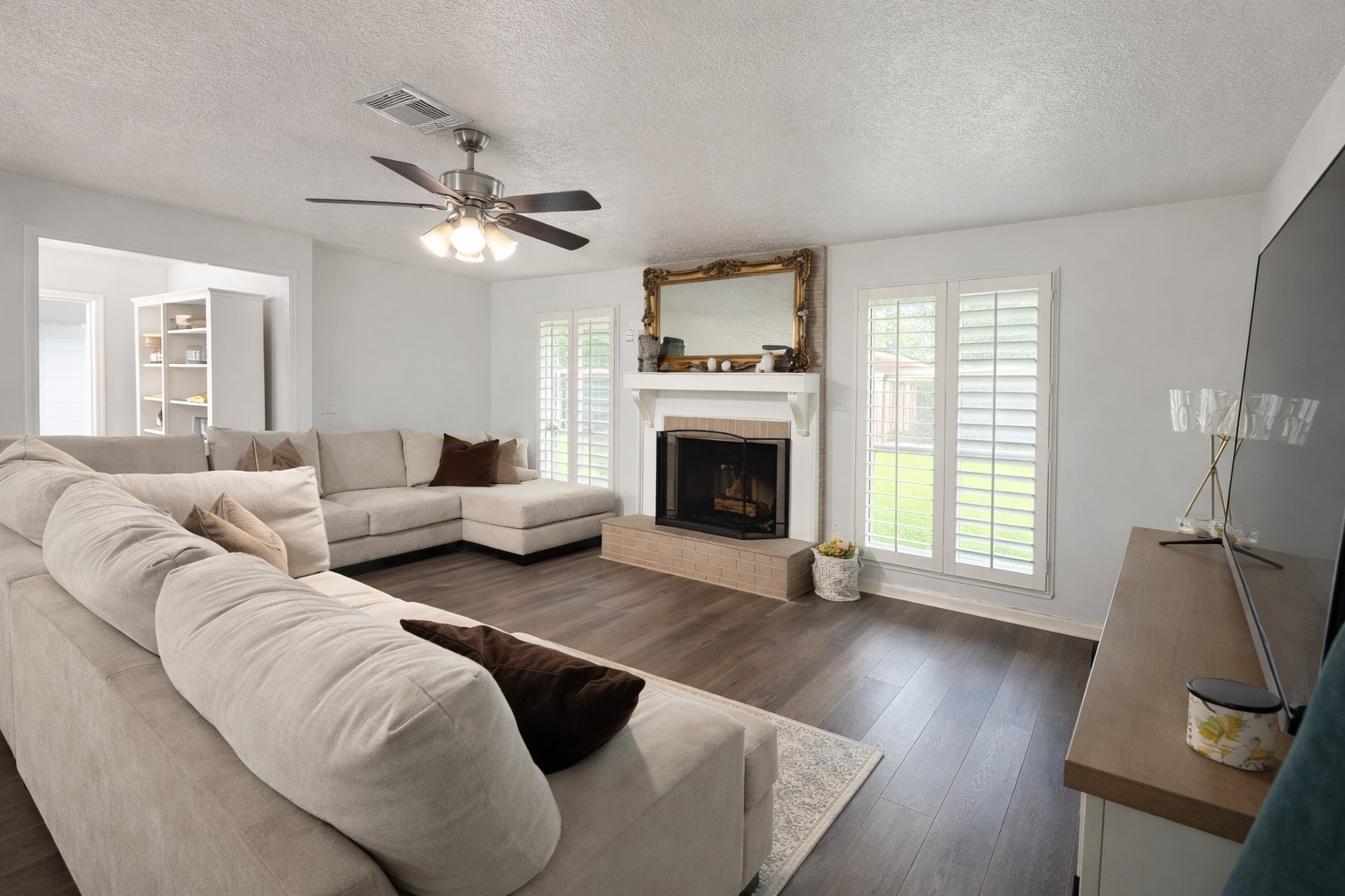 4415 Seminole Street Pasadena, TX 77504 - Photo 4 of 13 a living room with furniture and a fireplace