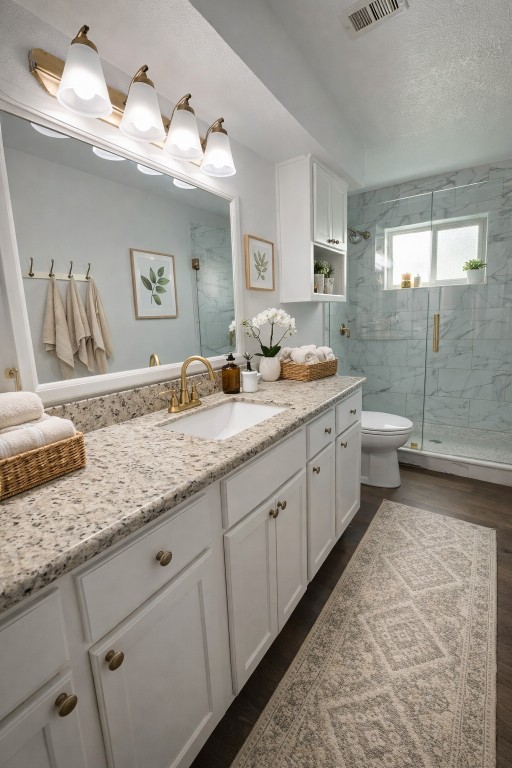 4415 Seminole Street Pasadena, TX 77504 - Photo 10 of 13 a spacious bathroom with a granite countertop sink a toilet a large mirror and shower