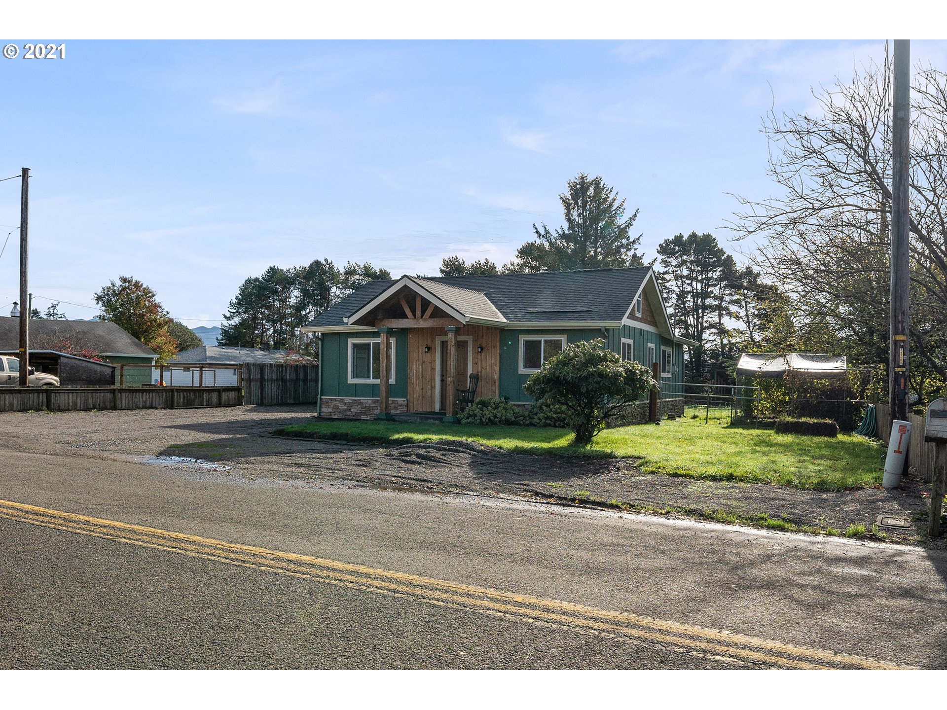 1915 Tone Road Tillamook, OR 97141 - Photo 22 of 24 a front view of a house with a yard